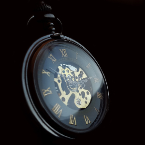 Close-up of a pocket watch with roman numerals, symbolizing the countdown to expatriate tax changes and deadlines.