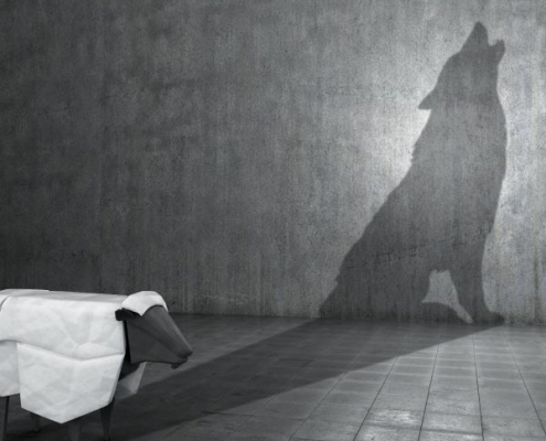 Sheep casting a wolf shadow symbolising expatriate tax scams