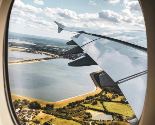 View from an airplane window as an expat returns to South Africa, symbolizing tax residency reinstatement with SARS.