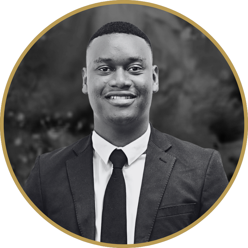 Professional black and white headshot of Rendani, a smiling young Black man in a suit and tie, framed in gold.